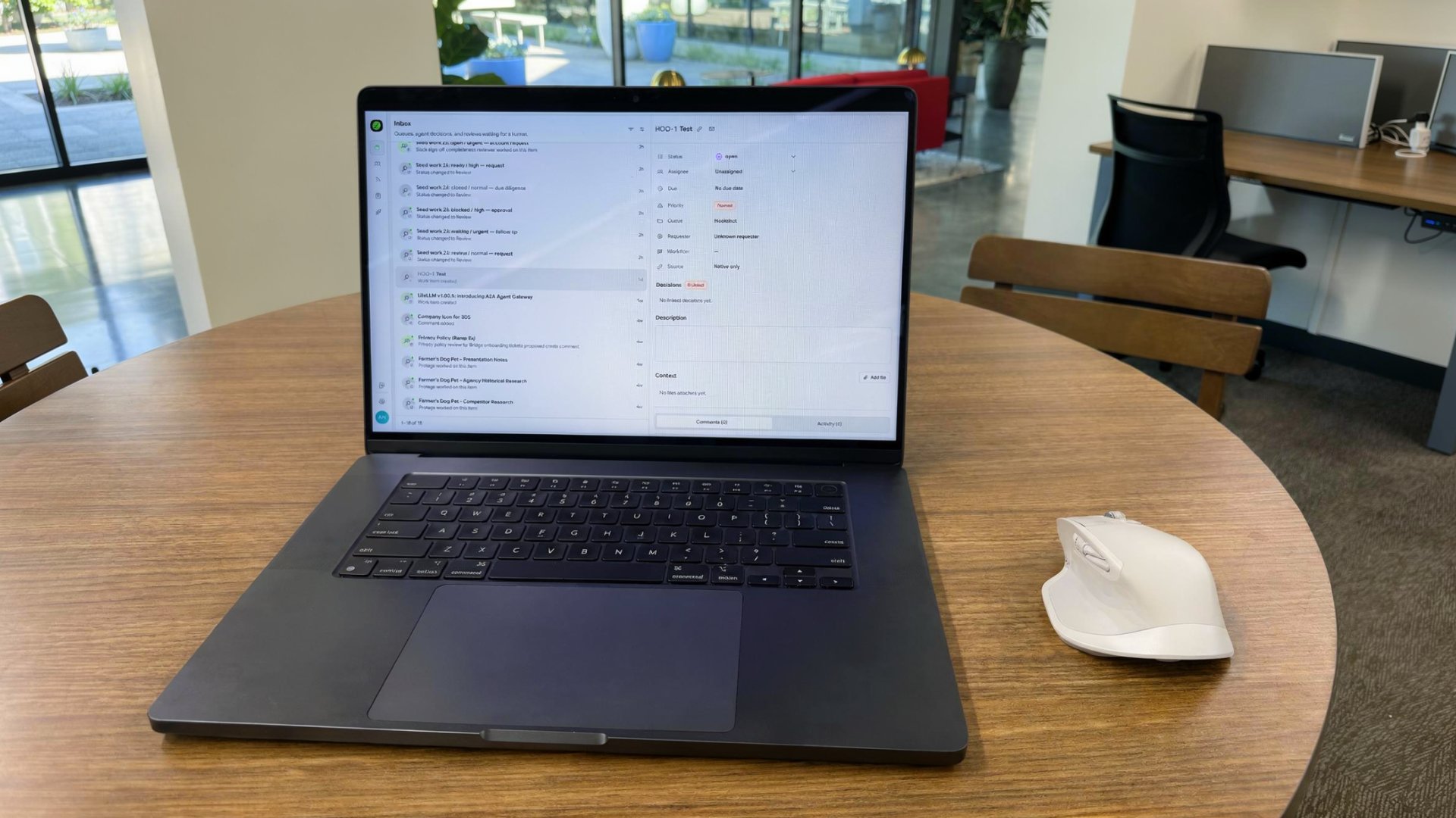 Workhub inbox on a laptop showing open work, pending agent decisions, and priority tickets across Asana, Jira, and ServiceNow